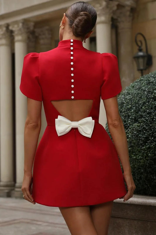 The Swiss Bow Button Dress